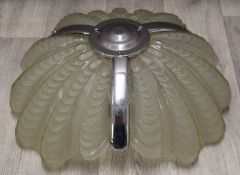 Art Deco glass lamp with three ribbed or shell shaped glass sections, supported on chains,