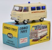 Corgi Toys diecast model Commer Ambulance with cream body, red interior blue windows and shaped
