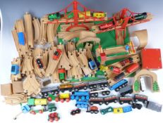 A large collection of Brio wooden track and accessories including bridges, tunnels and trains.