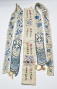 A pair of Chinese 19thC silk ties decorated with embroidered birds, auspicious symbols, insects