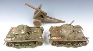 Two GAMA of Germany battery operated tinplate model tanks together with a similar tinplate model