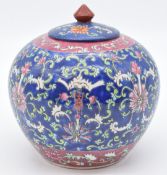 Chinese ginger jar with pink, blue and green enamel decoration and four character mark to base, 21cm