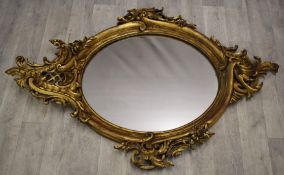 19th/20thC royalcore gilt framed mirror with flower and swag decoration, 132 x 91cm