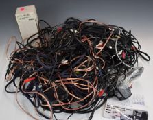 A collection of electric guitar related items to include auto tuner, leads, capos, pedal etc, in a