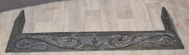 Arts and Crafts copper fire curb with opposing dragons in relief, W137cm
