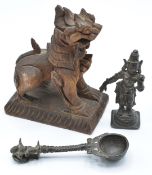 Two Burmese bronzes, one a spoon the other a female warrior, together with a wooden dragon marked