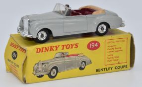 Dinky Toys diecast model Bentley Coupe with grey body, maroon interior, driver and suspension,