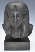 Egyptian green schist head carved in the form of king or God wearing a tripartite striated wig and