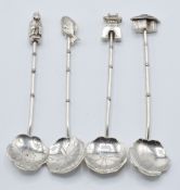 Set of four Chinese or Hong Kong silver novelty spoons, the finials formed as buildings, deity and a