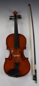 The Stentor Student 20thC violin, back length 35.5cm, with bow and 'Fast Forward' tutor books, in