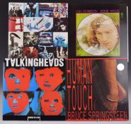 Approximately 36 albums including Dire Straits, U2, The Rolling Stones, Bruce Springsteen, Paul