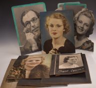 Nine vintage optician's shop display advertising boards, most showing girls wearing spectacles,