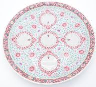 Chinese late 19th/20thC famille rose charger decorated with owls and flowers, with red iron Qianlong