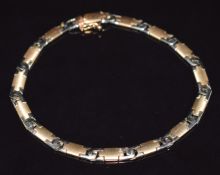 A 14k gold bi-coloured bracelet, 20cm long , 14.9g