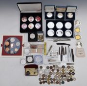 A collection of crowns including Royal Mint, three cased silver commemorative examples, some sets,