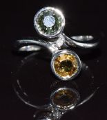 A 9k white gold ring set with sapphires and a diamond, 3.5g, size N