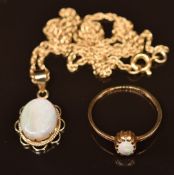 A 9ct gold ring and pendant set with opal and a 9ct gold chain, 4.3g