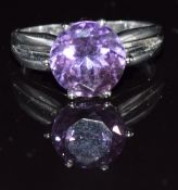 A 9k white gold ring set with a round cut amethyst, 4.6g, size Q