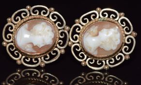 A pair of 9ct gold earrings set with cameos, 7.6g