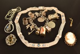 A five strand silver necklace, silver serpent pendant set with sodalite, silver charm bracelet and a