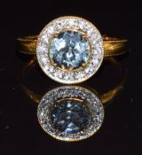 A 9k gold ring set with an aquamarine and white sapphires, 2.2g, size O