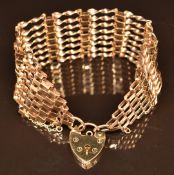 A 9ct gold gate bracelet with heart padlock clasp, 18.9g
