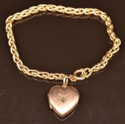 A 9ct gold bracelet with Victorian heart locket set with a diamond, 9.4g