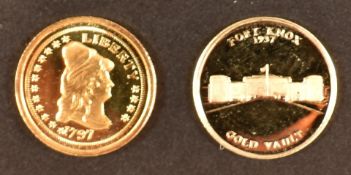 Two USA miniature gold coins comprising 'World's Smallest Gold Coin' Fort Knox, and one other,