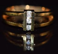 A 9k gold ring set with three diamonds, 4.1g, size M