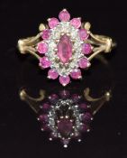 A 9ct gold ring set with diamonds and rubies in a marquise setting, 2.9g, size M