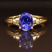 An 18ct gold ring set with an oval cut tanzanite, 3.8g, size M