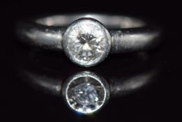 A platinum ring set with a round brilliant cut diamond of approximately 0.5ct, 7.8g, size J