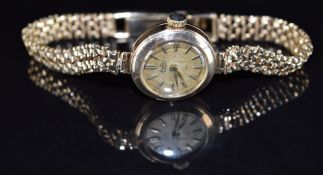 Bertina 9ct gold ladies wristwatch with gold hands and hour markers, champagne dial and signed 17