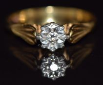 An 18ct gold ring set with a diamond in an illusion setting, 3.7g, size M