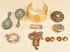 A collection of jewellery including Krug bangle, silver brooches including Robert Alliston, silver