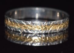 A 22ct bi-coloured gold ring with textured design, 2.83g, size P