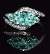 A 9k white gold ring set with emeralds and diamonds, 2.8g, size P