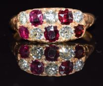 A c1900 18ct gold ring set with five old cut diamonds and five rubies, 4.5g, size P