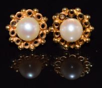 A pair of 9ct gold earrings set with a pearl to each, 2g