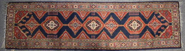 Chirvan runner with a central line of seven guls, by repute purchased from Liberty's, 245 x 67cm