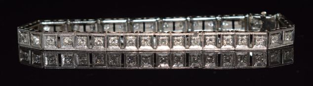 A 14k white gold tennis bracelet set with diamonds each approximately 0.07ct each, 17.5cm long, 11.