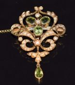 Edwardian 15ct gold pendant/ brooch set with peridot and seed pearls, 6.7g, 4 x 3cm