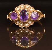 A 9ct gold ring set with amethysts and seed pearls, 3.3g, size N