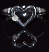 A 9k white gold ring set with a diamond in a heart setting,1.6g, size M