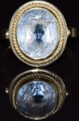 A 14k gold ring set with an oval cut aquamarine, 4.4g, size S