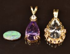 Two 9ct gold pendants, one set with an aquamarine the other amethyst (4.2g) and an opal triplet