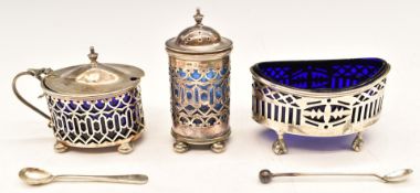 Hallmarked silver cruet items comprising pepper, open salt raised on ball and claw feet and a