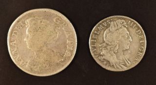 Queen Anne 1711 shilling, F, together with a William III 1697 sixpence, GF