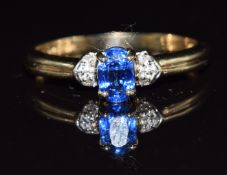 A 9ct gold ring set with an oval cut sapphire and diamonds, 2g, size P