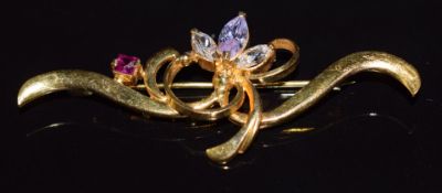 A 22ct gold brooch set with zircon and a ruby, 7.6g, 5.5cm long
